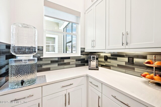 210 Terra Oaks Dr, Saint Johns, FL 32259 - kitchen with decorative backsplash, white cabinets, and light countertops