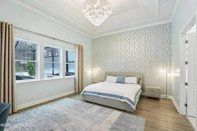 210 Terra Oaks Dr, Saint Johns, FL 32259 - bedroom with ornamental molding, wood finished floors, a chandelier, baseboards, and wallpapered walls