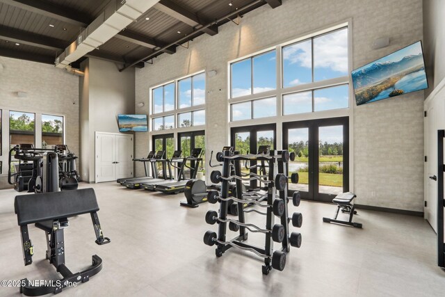 210 Terra Oaks Dr, Saint Johns, FL 32259 - workout area with a high ceiling, french doors, healthy amount of natural light, and wood ceiling with exposed beams
