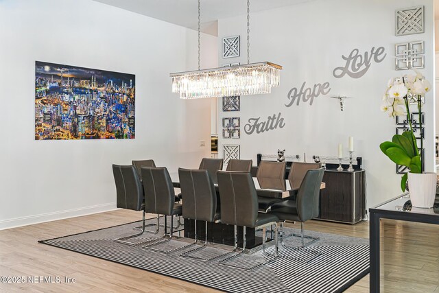 210 Terra Oaks Dr, Saint Johns, FL 32259 - dining room featuring a chandelier, wood finished floors, and a high ceiling