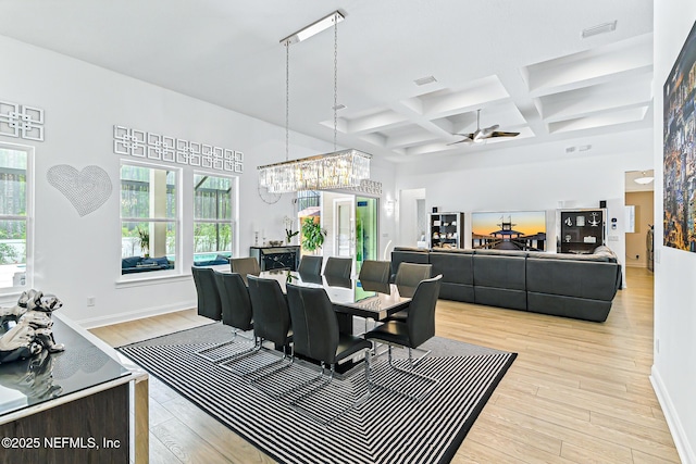 210 Terra Oaks Dr, Saint Johns, FL 32259 - dining room featuring coffered ceiling, light wood finished floors, beam ceiling, ceiling fan, and a chandelier