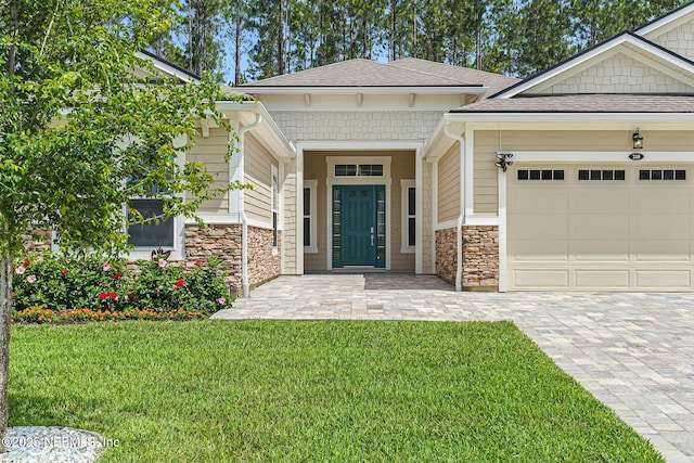 210 Terra Oaks Dr, Saint Johns, FL 32259 - view of front facade with stone siding, a garage, a front lawn, a shingled roof, and decorative driveway