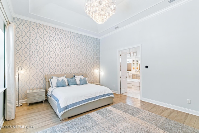 210 Terra Oaks Dr, Saint Johns, FL 32259 - bedroom with wallpapered walls, a chandelier, light wood-type flooring, crown molding, and ensuite bath