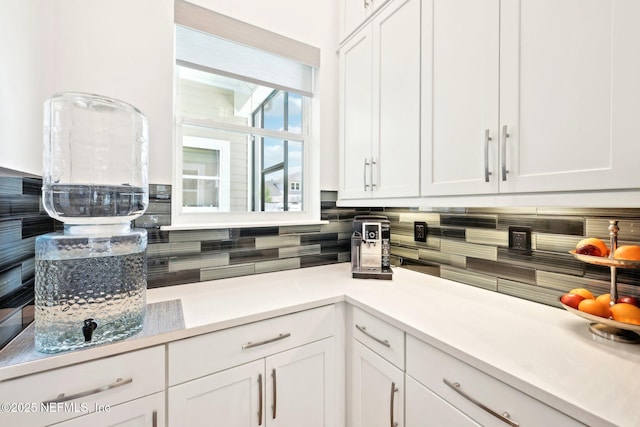 210 Terra Oaks Dr, Saint Johns, FL 32259 - kitchen featuring decorative backsplash, white cabinets, and light countertops