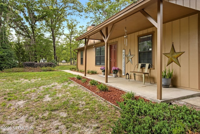view of yard with covered porch