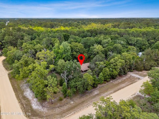 drone / aerial view of a heavily wooded area
