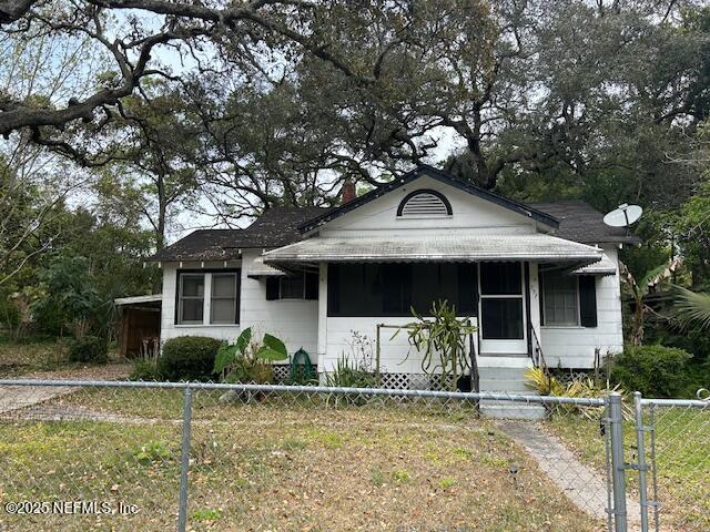 257 E 47th St, Jacksonville, FL 32208 - bungalow-style house with a fenced front yard and entry steps