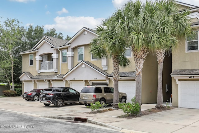 607 Golden Lake Loop, Saint Augustine, FL 32084 - view of property with an attached garage, driveway, and stucco siding