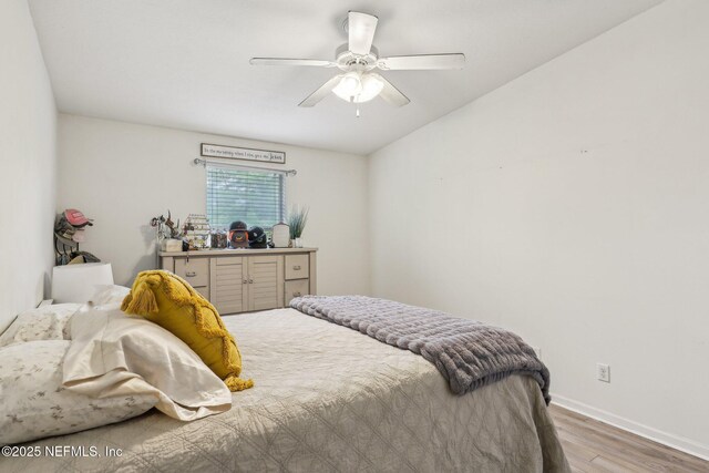 607 Golden Lake Loop, Saint Augustine, FL 32084 - bedroom with wood finished floors, baseboards, and a ceiling fan