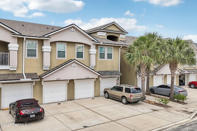 607 Golden Lake Loop, Saint Augustine, FL 32084 - multi unit property featuring stucco siding, driveway, a garage, and a shingled roof