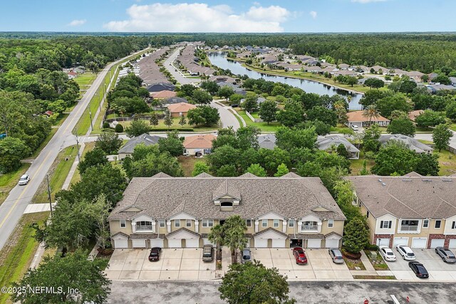 607 Golden Lake Loop, Saint Augustine, FL 32084 - aerial perspective of suburban area featuring a large body of water and a heavily wooded area