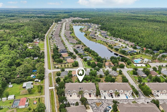 607 Golden Lake Loop, Saint Augustine, FL 32084 - aerial view of property and surrounding area with a heavily wooded area, nearby suburban area, and a nearby body of water