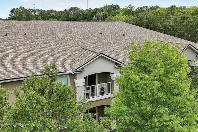 607 Golden Lake Loop, Saint Augustine, FL 32084 - back of house with stucco siding and a shingled roof