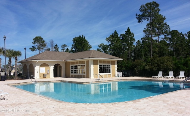 607 Golden Lake Loop, Saint Augustine, FL 32084 - community pool featuring a patio and fence