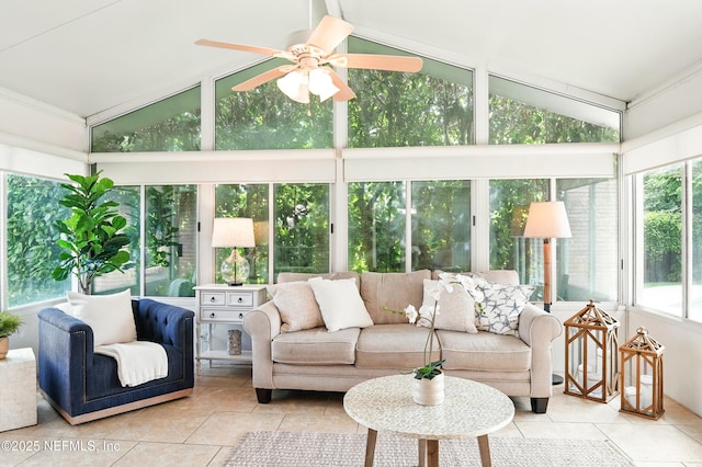 sunroom featuring tile patterned flooring and high vaulted ceiling