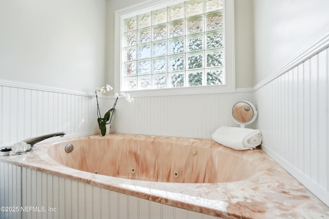 bathroom featuring a whirlpool tub