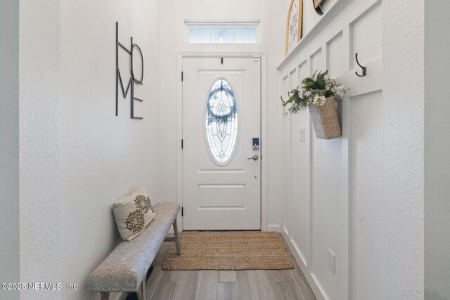 doorway featuring wood finished floors
