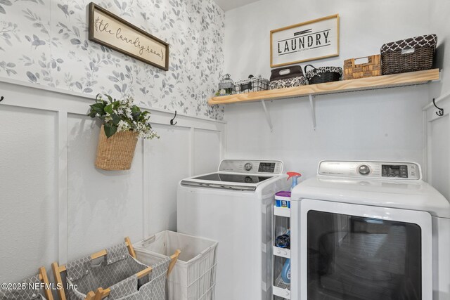 washroom featuring washing machine and dryer