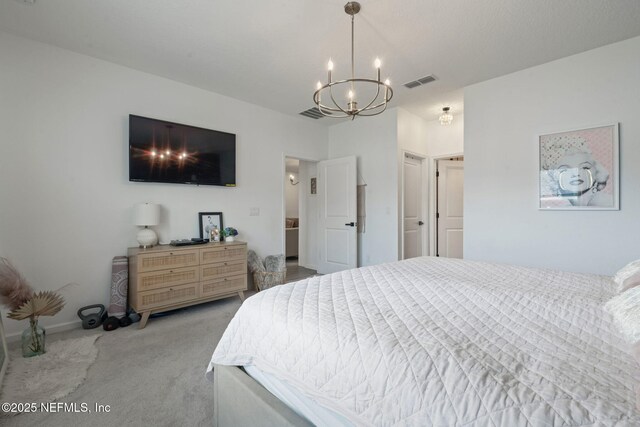 bedroom with carpet and a chandelier