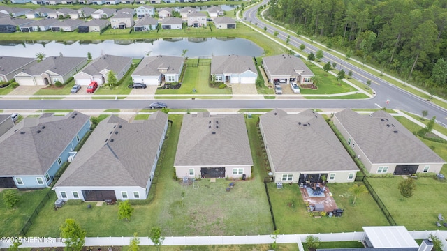 view of property location with a large body of water and nearby suburban area