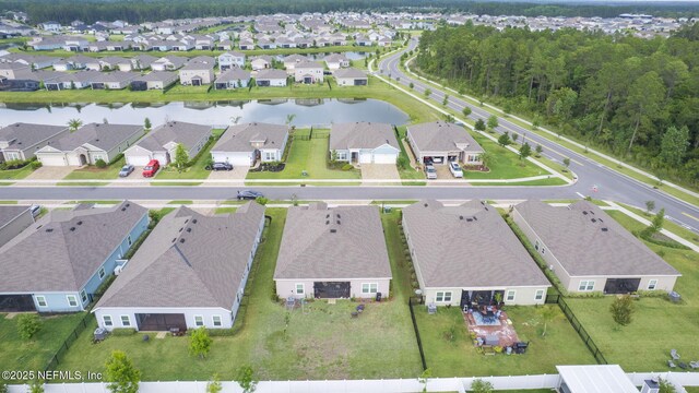 aerial view of property's location featuring nearby suburban area and a nearby body of water
