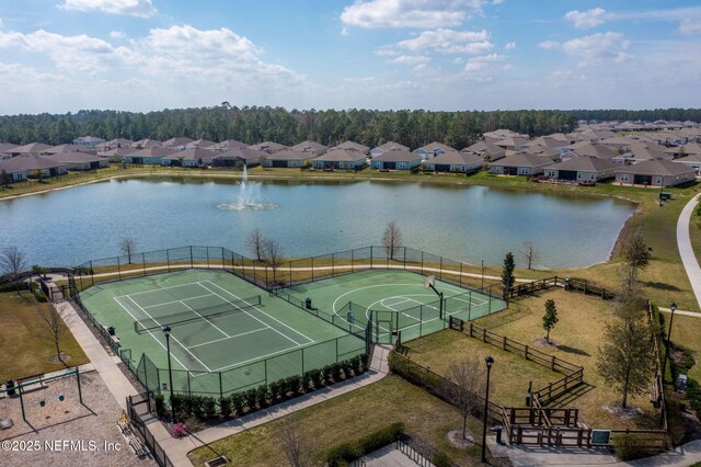 aerial view of residential area with a large body of water