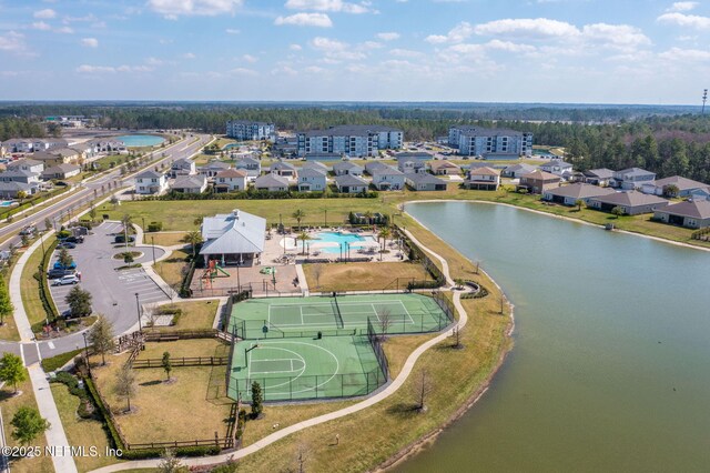 bird's eye view of a pool area and a nearby body of water