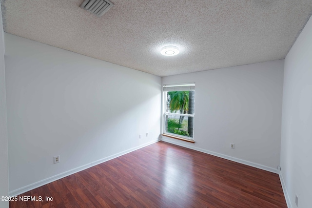 4837 Wethersfield Pl W, Jacksonville, FL 32257 - spare room with wood finished floors, a textured ceiling, and baseboards