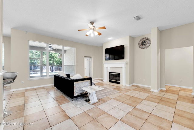 11658 Jerry Adam Ct, Jacksonville, FL 32218 - tiled living room with a ceiling fan, a premium fireplace, and baseboards