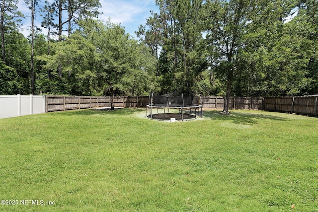 11658 Jerry Adam Ct, Jacksonville, FL 32218 - view of yard featuring a trampoline