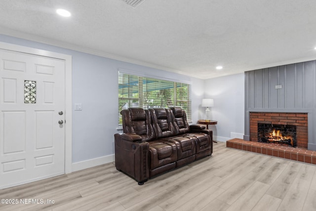 1874 Clinch Dr, Fernandina Beach, FL 32034 - living area with crown molding, light wood finished floors, baseboards, a fireplace, and recessed lighting