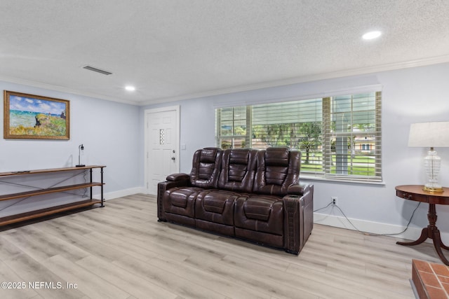 1874 Clinch Dr, Fernandina Beach, FL 32034 - living area featuring crown molding, light wood finished floors, recessed lighting, a textured ceiling, and baseboards