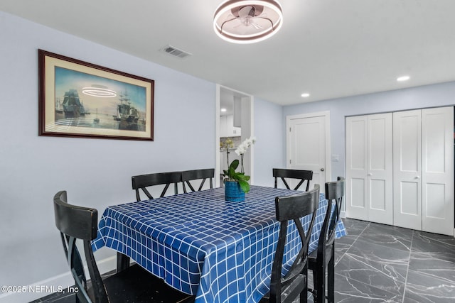 1874 Clinch Dr, Fernandina Beach, FL 32034 - dining area with recessed lighting, dark marble finish floors, and baseboards