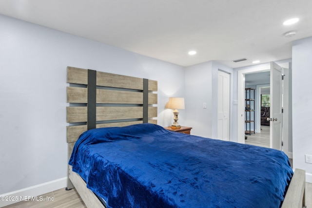 1874 Clinch Dr, Fernandina Beach, FL 32034 - bedroom featuring wood finished floors, baseboards, and recessed lighting