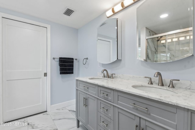 1874 Clinch Dr, Fernandina Beach, FL 32034 - bathroom featuring marble finish flooring, a shower stall, double vanity, baseboards, and recessed lighting