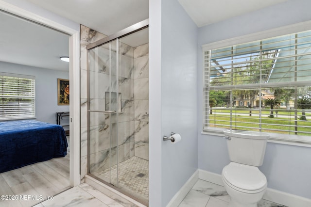 1874 Clinch Dr, Fernandina Beach, FL 32034 - bathroom with ensuite bathroom, marble finish flooring, a stall shower, and baseboards