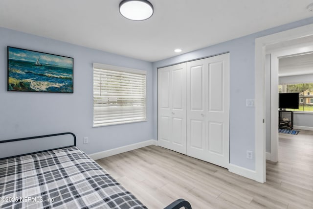 1874 Clinch Dr, Fernandina Beach, FL 32034 - unfurnished bedroom featuring light wood-type flooring, baseboards, a closet, and recessed lighting