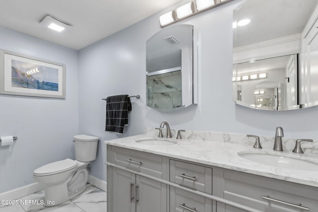 1874 Clinch Dr, Fernandina Beach, FL 32034 - full bathroom featuring toilet, marble finish flooring, baseboards, double vanity, and a shower with door