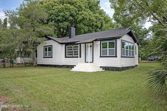 304 Lawton Ave, Jacksonville, FL 32208 - manufactured / mobile home featuring roof with shingles, a chimney, and crawl space