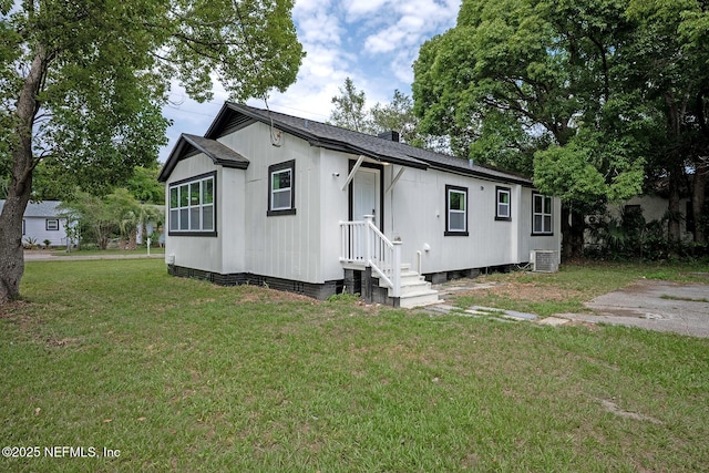 304 Lawton Ave, Jacksonville, FL 32208 - view of front facade featuring a front yard and central AC unit