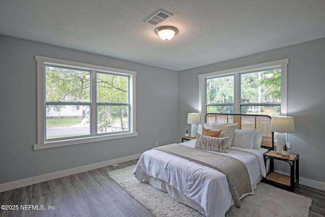 304 Lawton Ave, Jacksonville, FL 32208 - bedroom with baseboards and wood finished floors