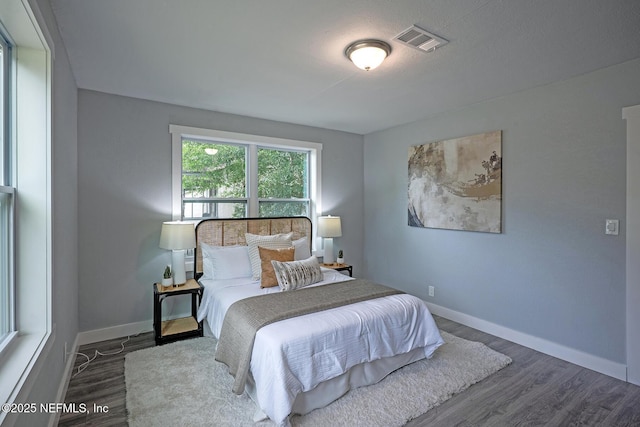 304 Lawton Ave, Jacksonville, FL 32208 - bedroom with wood finished floors and baseboards