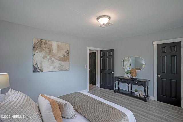 304 Lawton Ave, Jacksonville, FL 32208 - bedroom featuring wood finished floors and baseboards