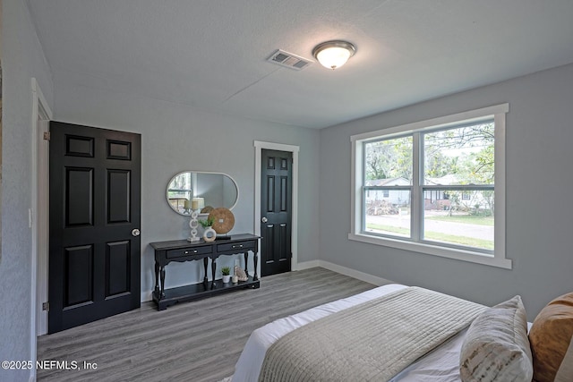 304 Lawton Ave, Jacksonville, FL 32208 - bedroom with wood finished floors and baseboards