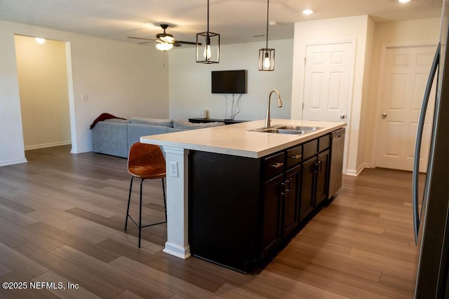 1863 Maxine Branch Way, Jacksonville, FL 32218 - kitchen featuring a sink, open floor plan, stainless steel appliances, light countertops, and a kitchen breakfast bar