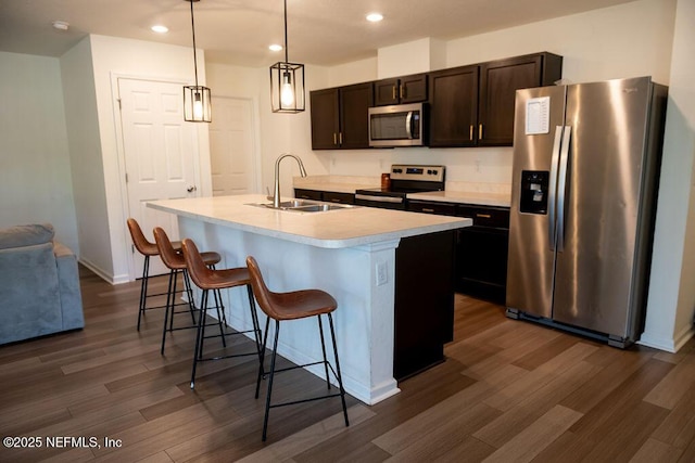 1863 Maxine Branch Way, Jacksonville, FL 32218 - kitchen with stainless steel appliances, a sink, dark wood-type flooring, recessed lighting, and light countertops