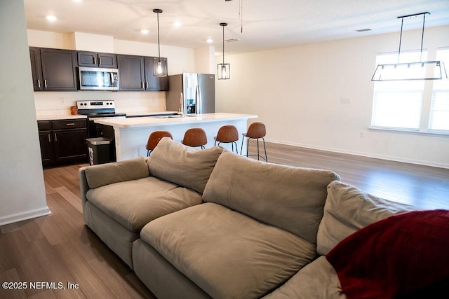 1863 Maxine Branch Way, Jacksonville, FL 32218 - kitchen with open floor plan, stainless steel appliances, light countertops, dark wood-type flooring, and recessed lighting