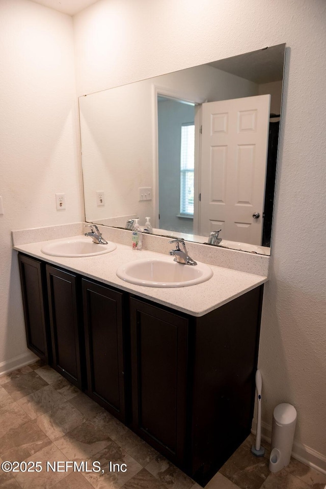 1863 Maxine Branch Way, Jacksonville, FL 32218 - bathroom featuring double vanity and baseboards