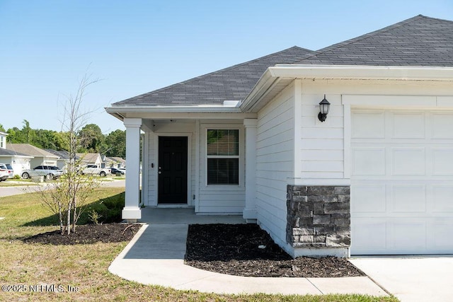 1863 Maxine Branch Way, Jacksonville, FL 32218 - entrance to property featuring a garage and roof with shingles