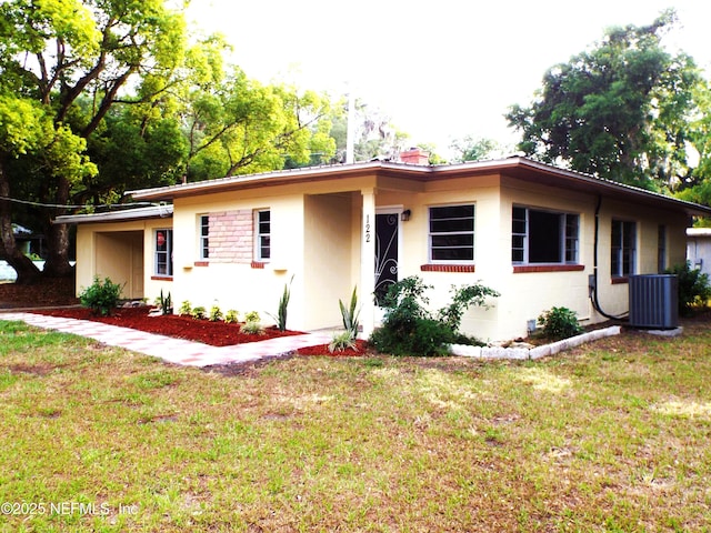 122 Husson Ave, Palatka, FL 32177 - single story home featuring central AC unit, a front yard, and a chimney